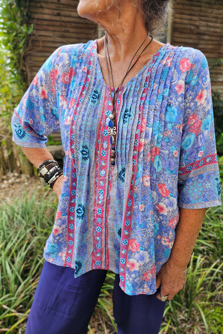 Person wearing a v-neck lavender rayon blouse