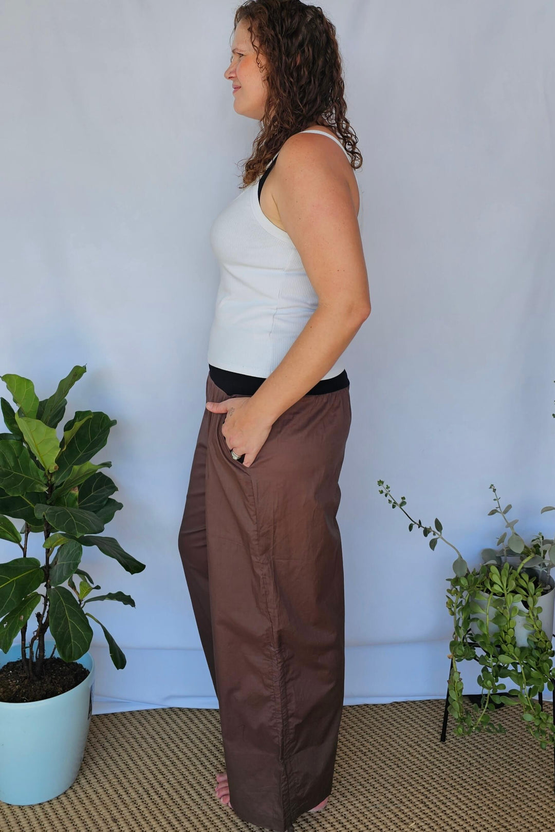 Side view showing waistband and leg fit of plus size tummy control pants