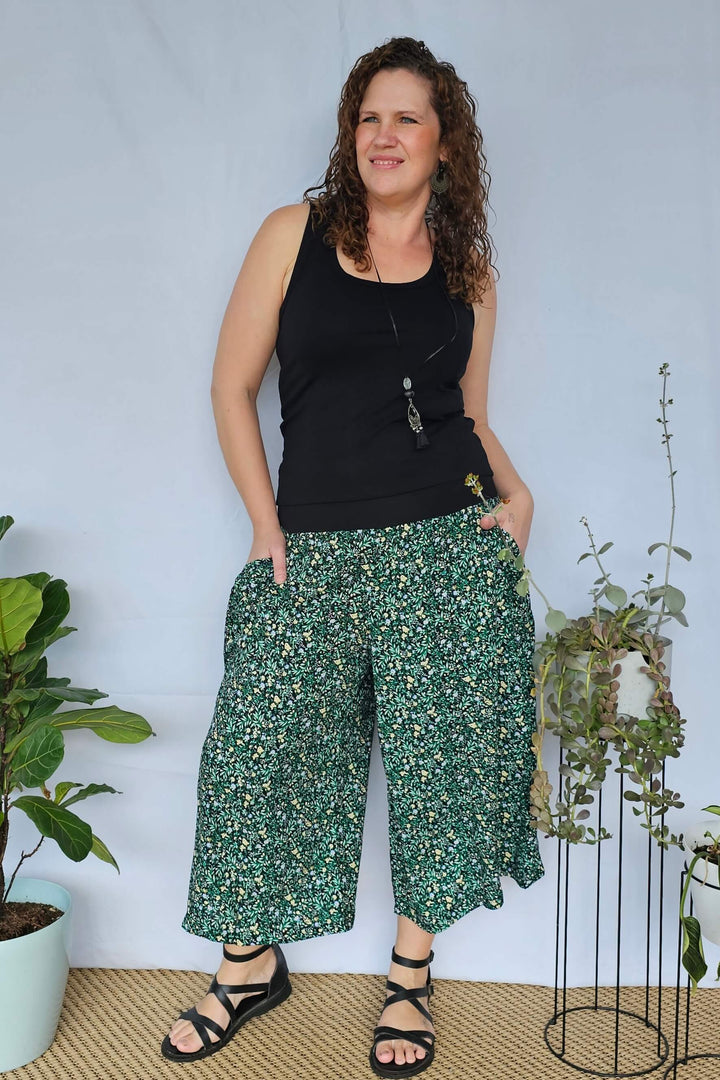 Model demonstrating the deep pockets of Green Bloom 7/8 Palazzo Pants