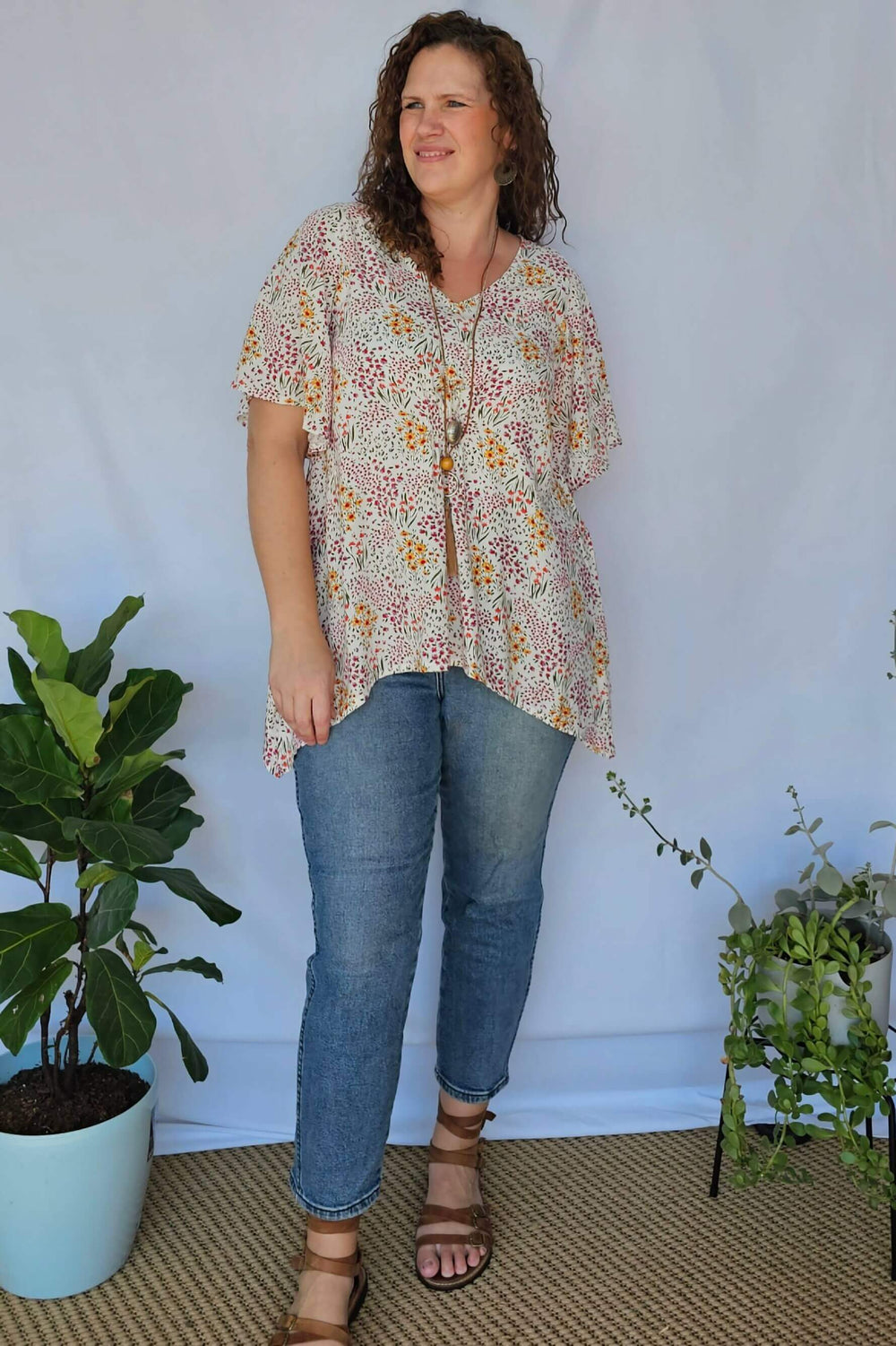 Model wearing Springtime Ola Top with jeans – plus size outfit idea