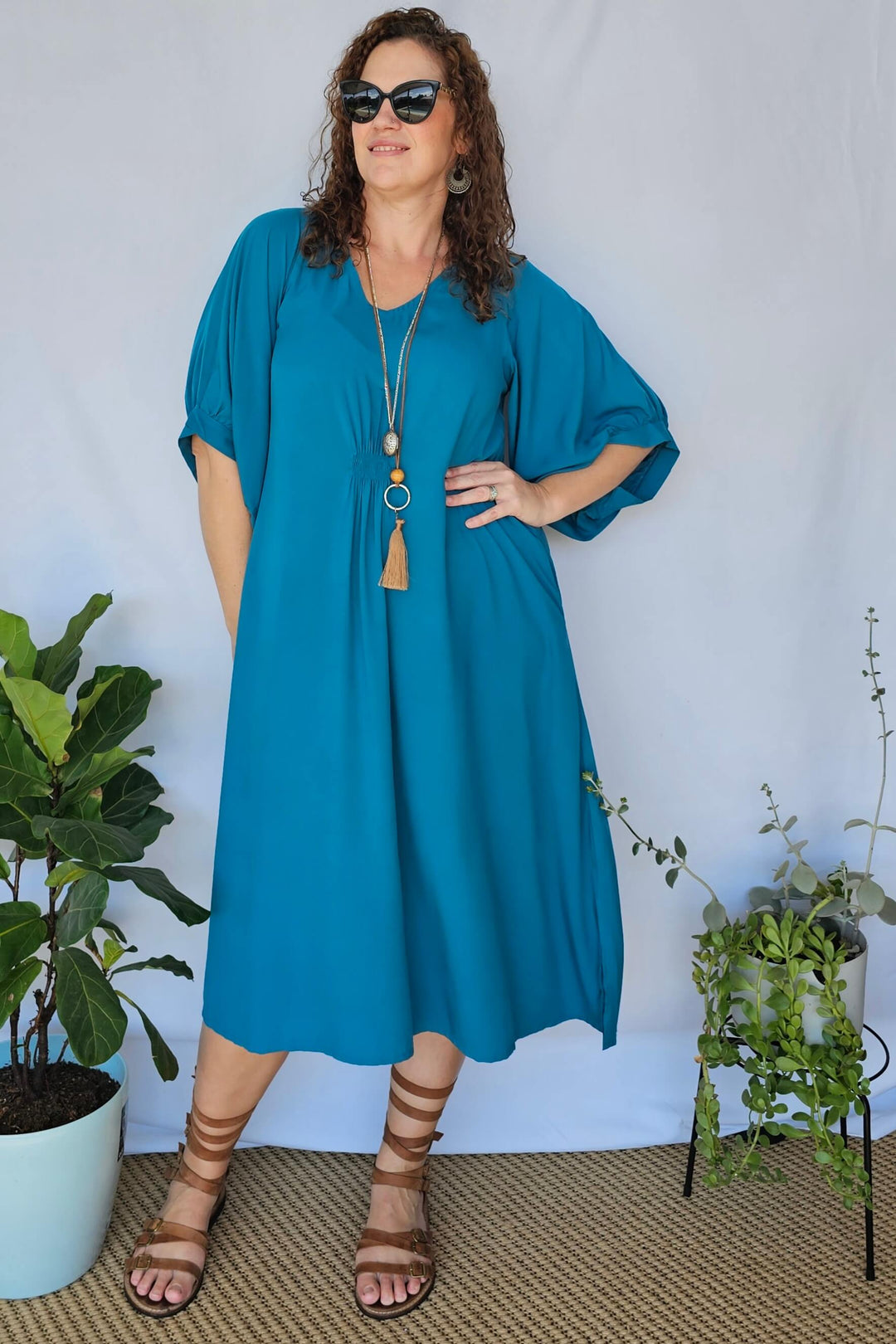 Front view of Teal Isla Dress with bell sleeves in size 16