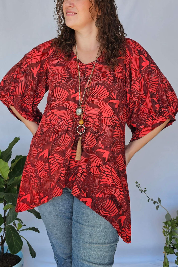 Close-up of shirred waist and soft rayon fabric in wine tones
