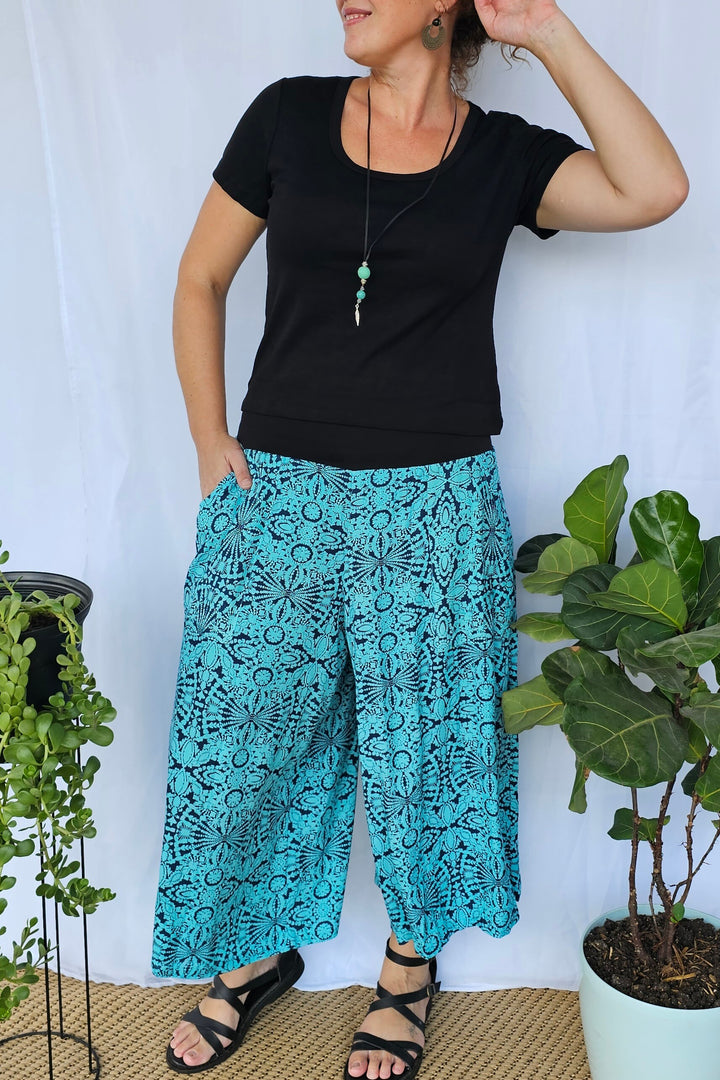Model wearing Blue Mandala 7/8 Palazzo Pants with a relaxed wide-leg silhouette and supportive stretch waistband.