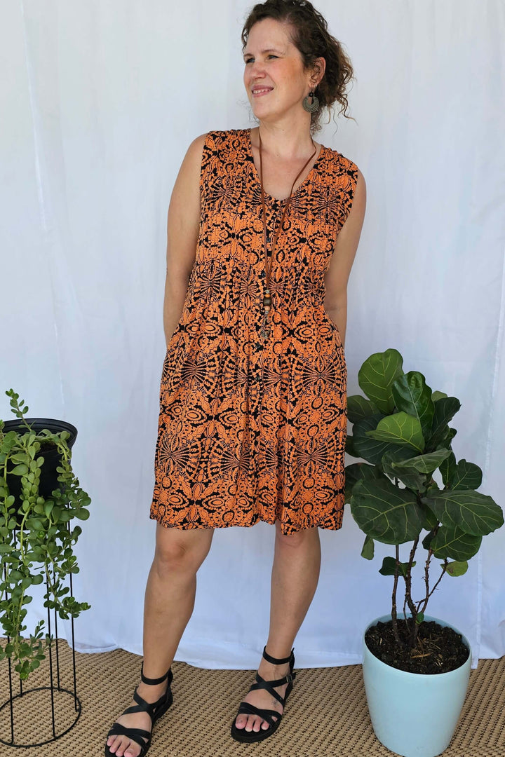 Front view of Orange Mandala Raya Dress highlighting pintuck bodice detail and soft draping rayon fabric.