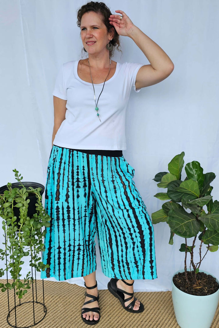 Front view of Sea Breeze wide-leg palazzo pants showing breathable rayon fabric and relaxed cropped length.