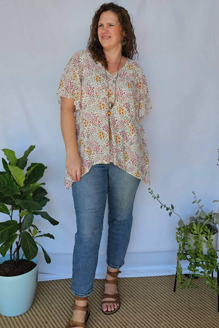Model wearing Springtime Ola Top with jeans – plus size outfit idea