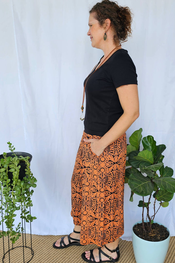 Side view of Orange Mandala 7/8 Palazzo Pants highlighting the flowy wide-leg shape and breathable rayon fabric.